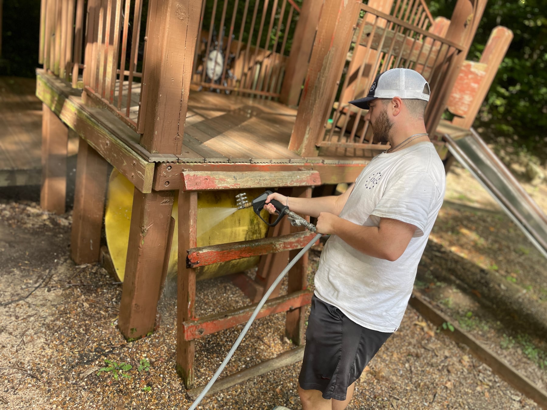 ATC cleaning an outdoor school play structure
